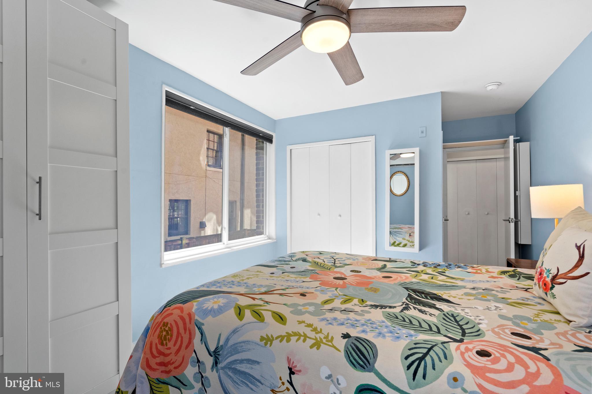 2639 15th Street Northwest, Unit 104 Washington, DC 20009 - Photo 22 of 36 a bedroom with a bed and a mirror