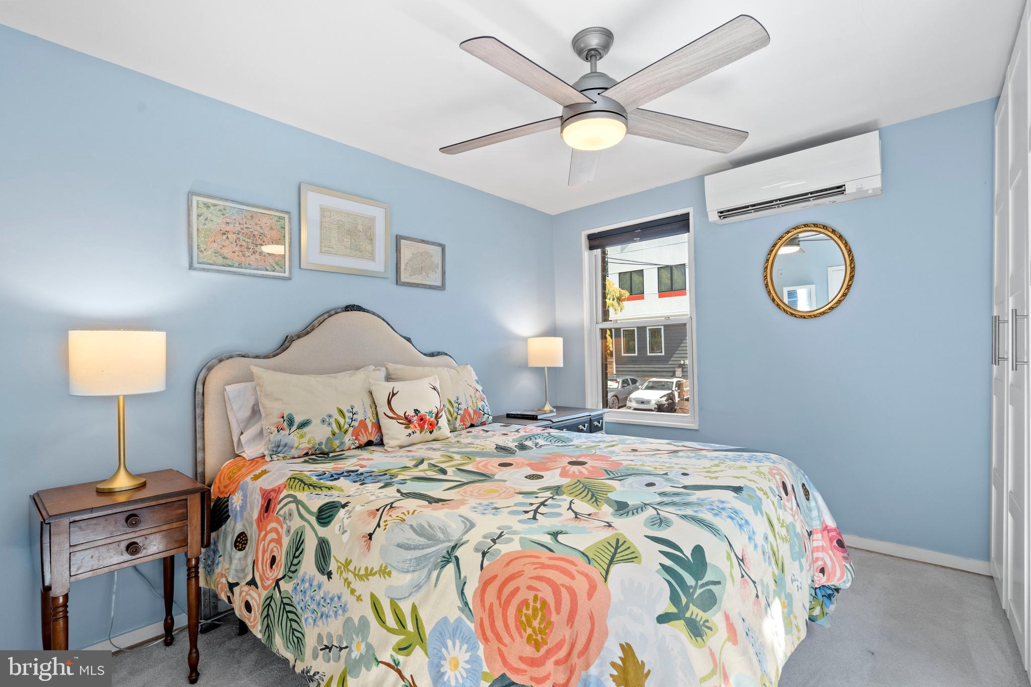 2639 15th Street Northwest, Unit 104 Washington, DC 20009 - Photo 23 of 36 a bedroom with a bed and a chandelier