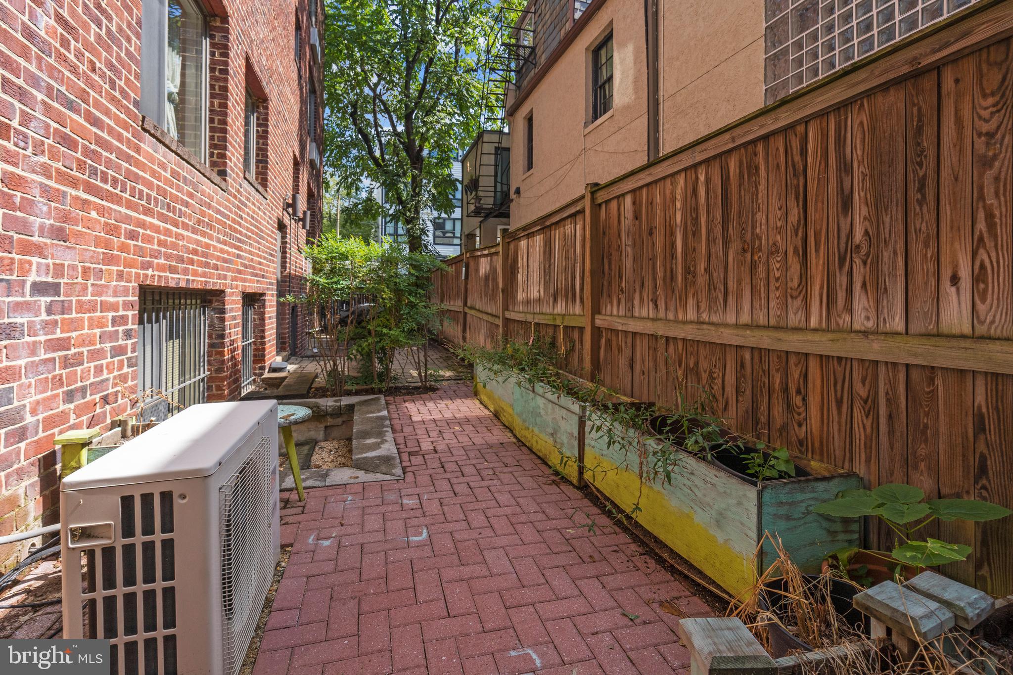 2639 15th Street Northwest, Unit 104 Washington, DC 20009 - Photo 26 of 36 a view of a house with backyard and sitting area