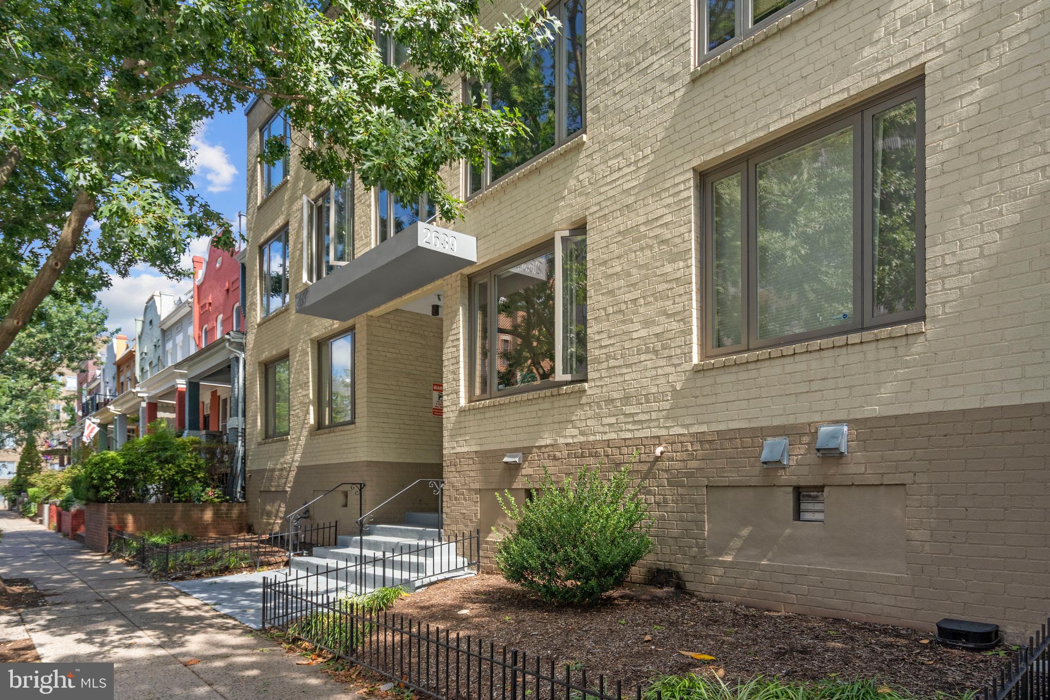 2639 15th Street Northwest, Unit 104 Washington, DC 20009 - Photo 27 of 36 a view of a brick house with many windows