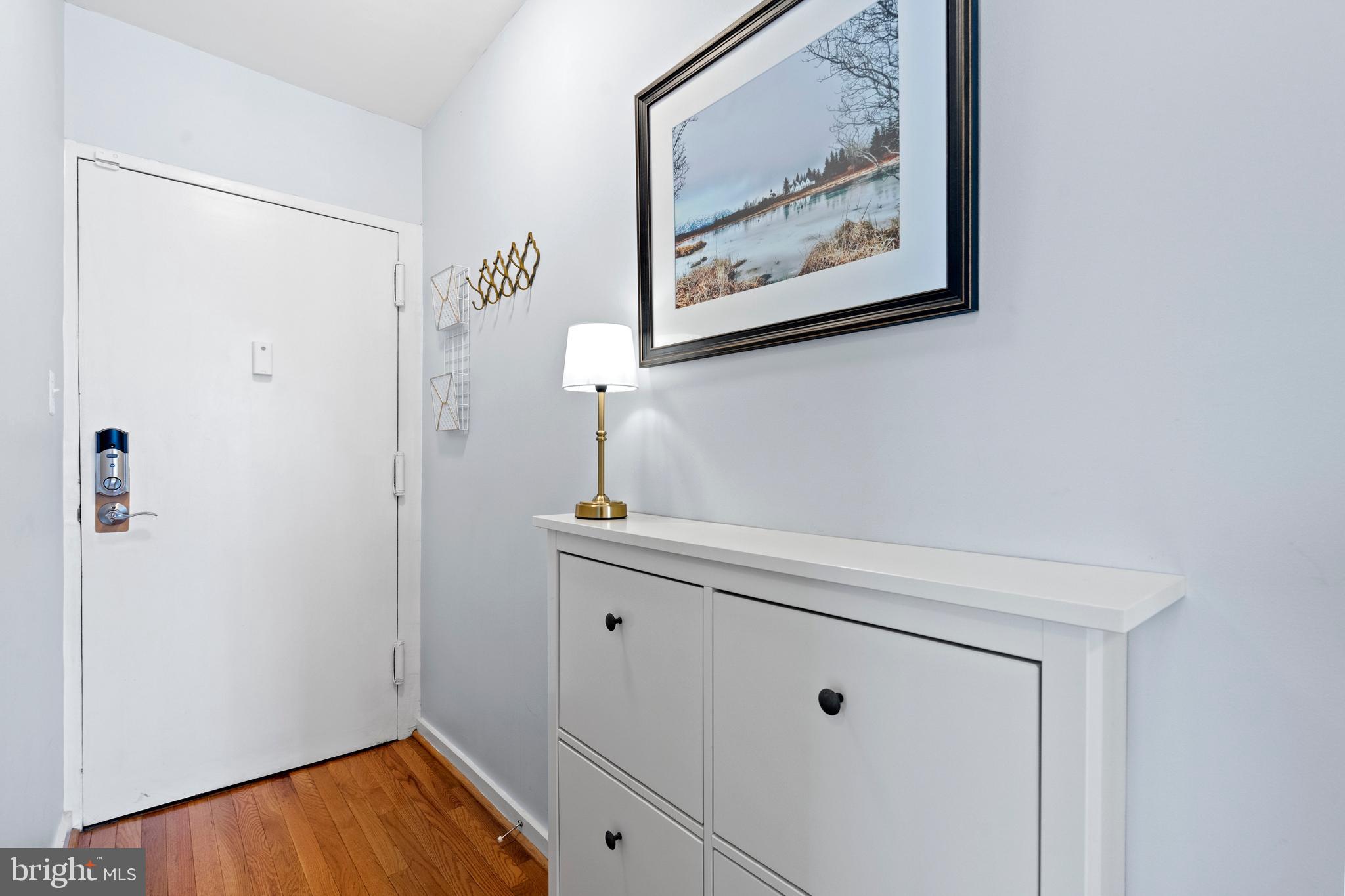 2639 15th Street Northwest, Unit 104 Washington, DC 20009 - Photo 3 of 36 a view of cabinets with wooden floor