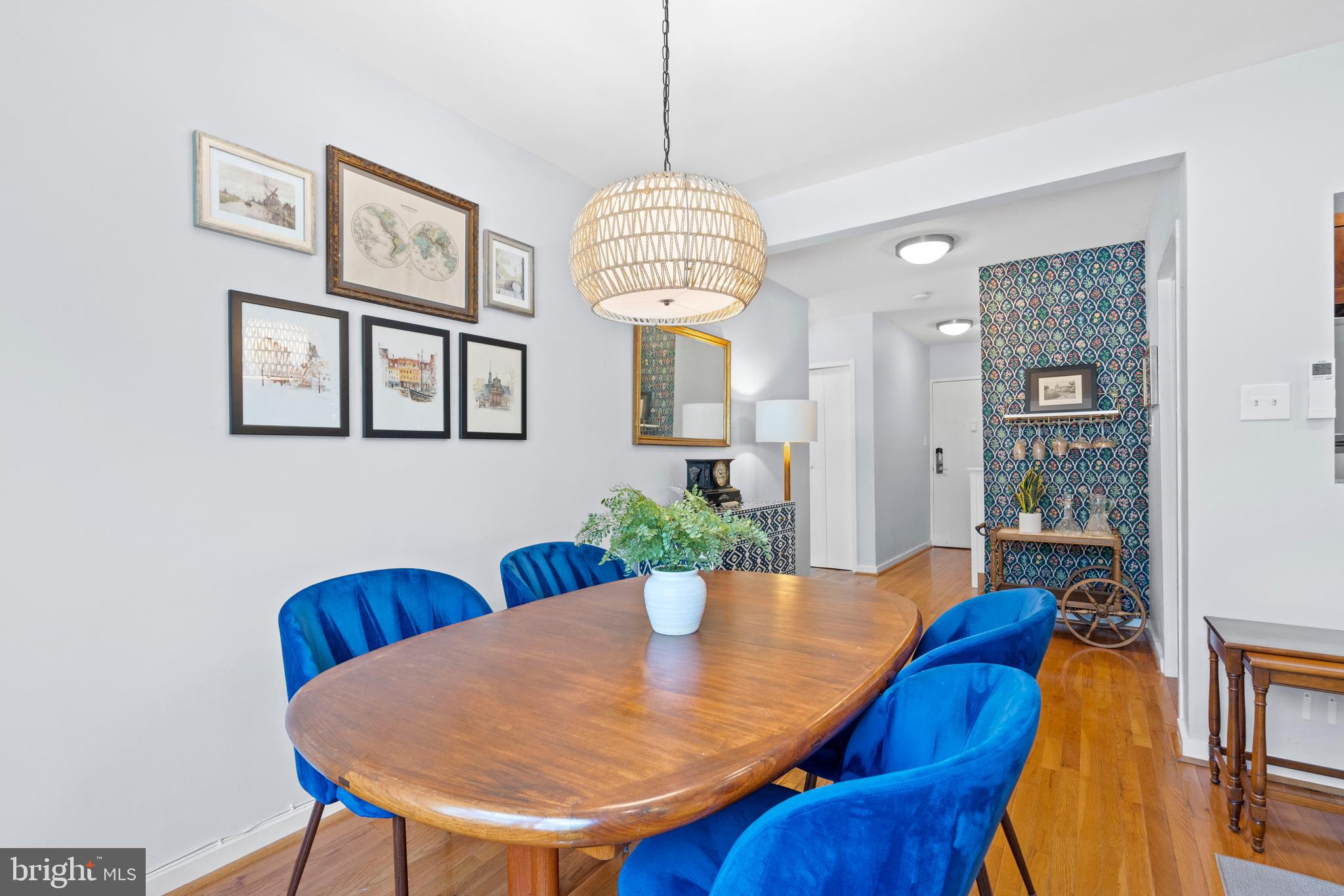 2639 15th Street Northwest, Unit 104 Washington, DC 20009 - Photo 7 of 36 a view of a dining room with furniture and wooden floor