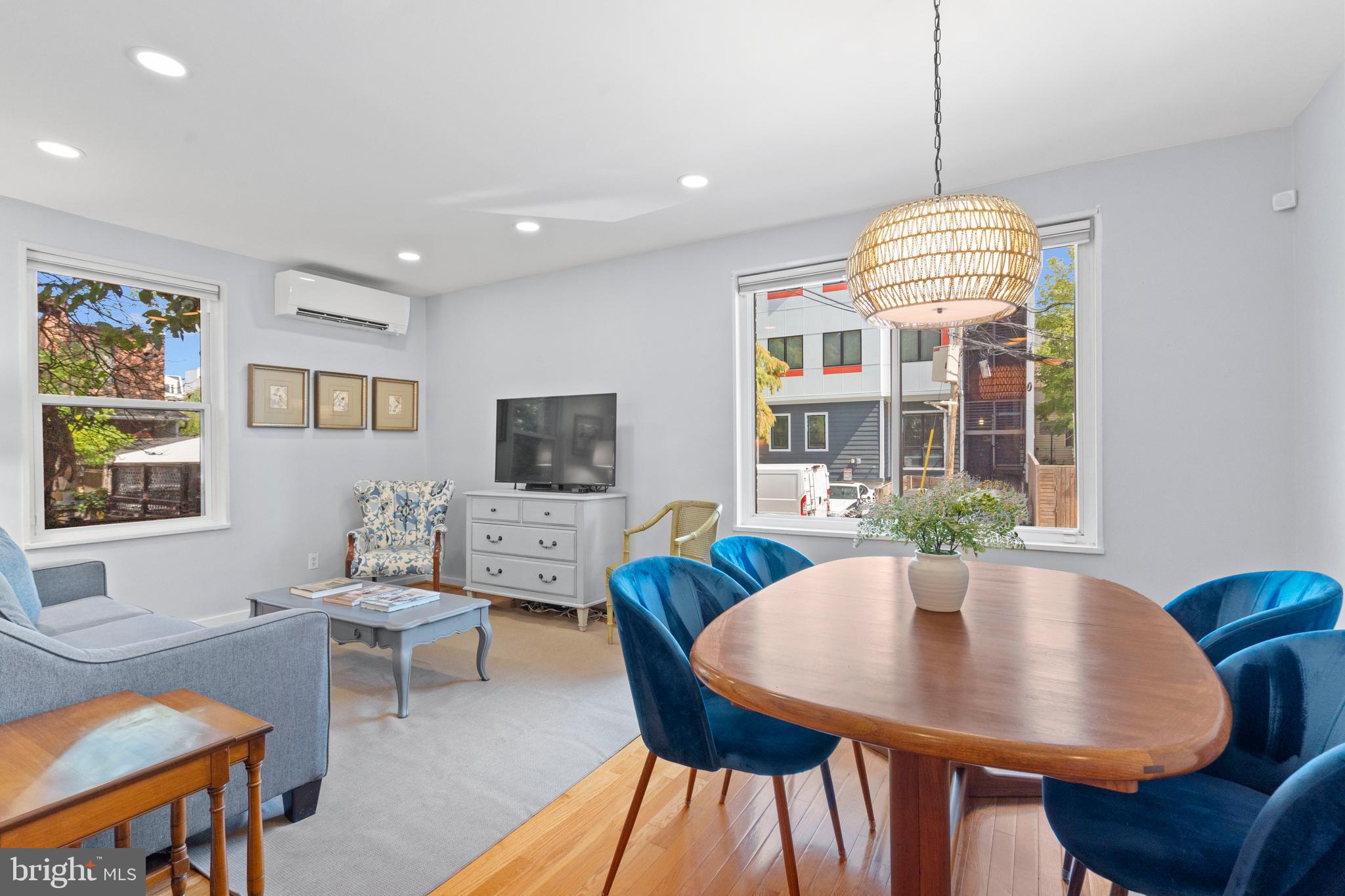 2639 15th Street Northwest, Unit 104 Washington, DC 20009 - Photo 8 of 36 a view of a dining room with furniture window and wooden floor