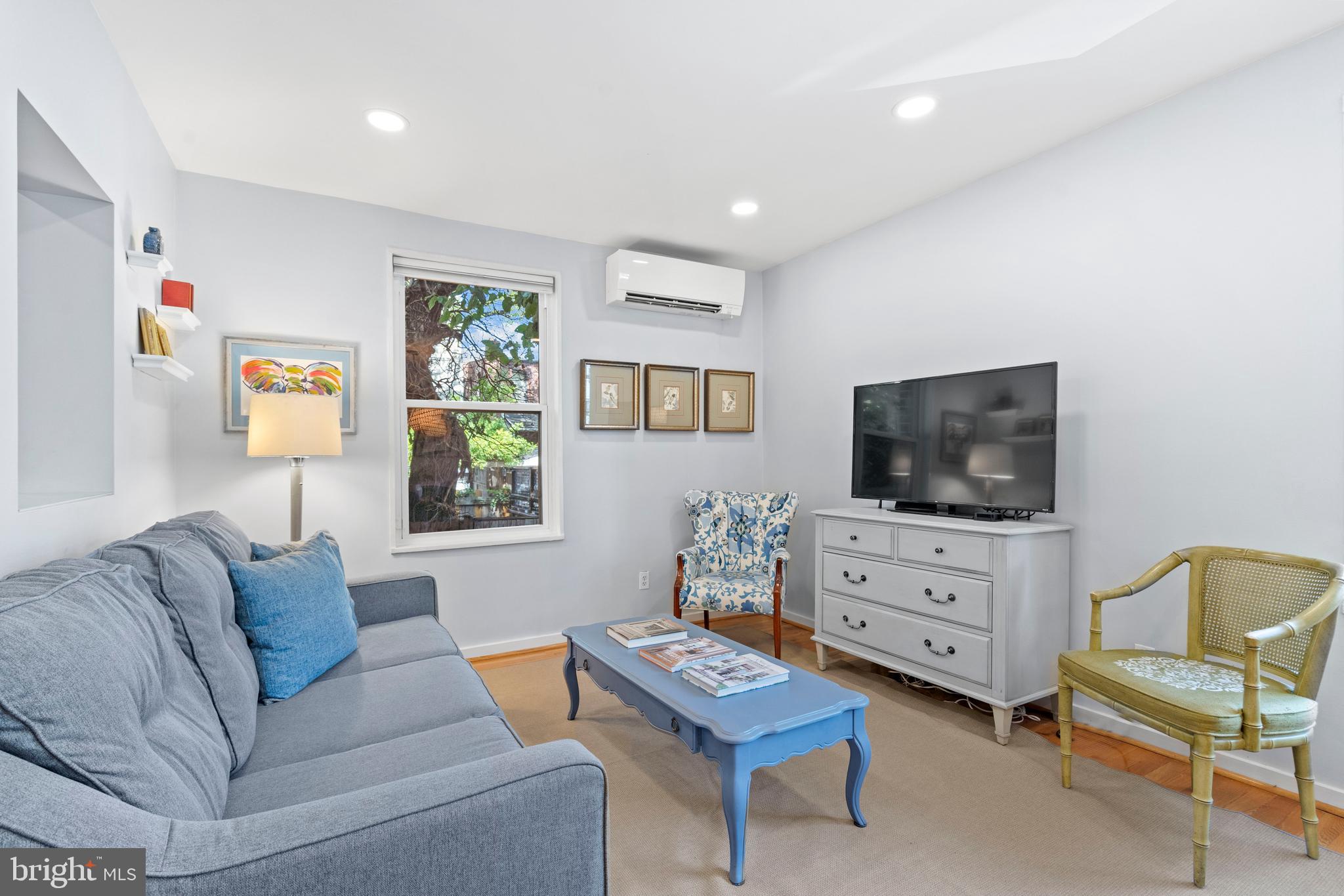 2639 15th Street Northwest, Unit 104 Washington, DC 20009 - Photo 10 of 36 a living room with furniture and a flat screen tv