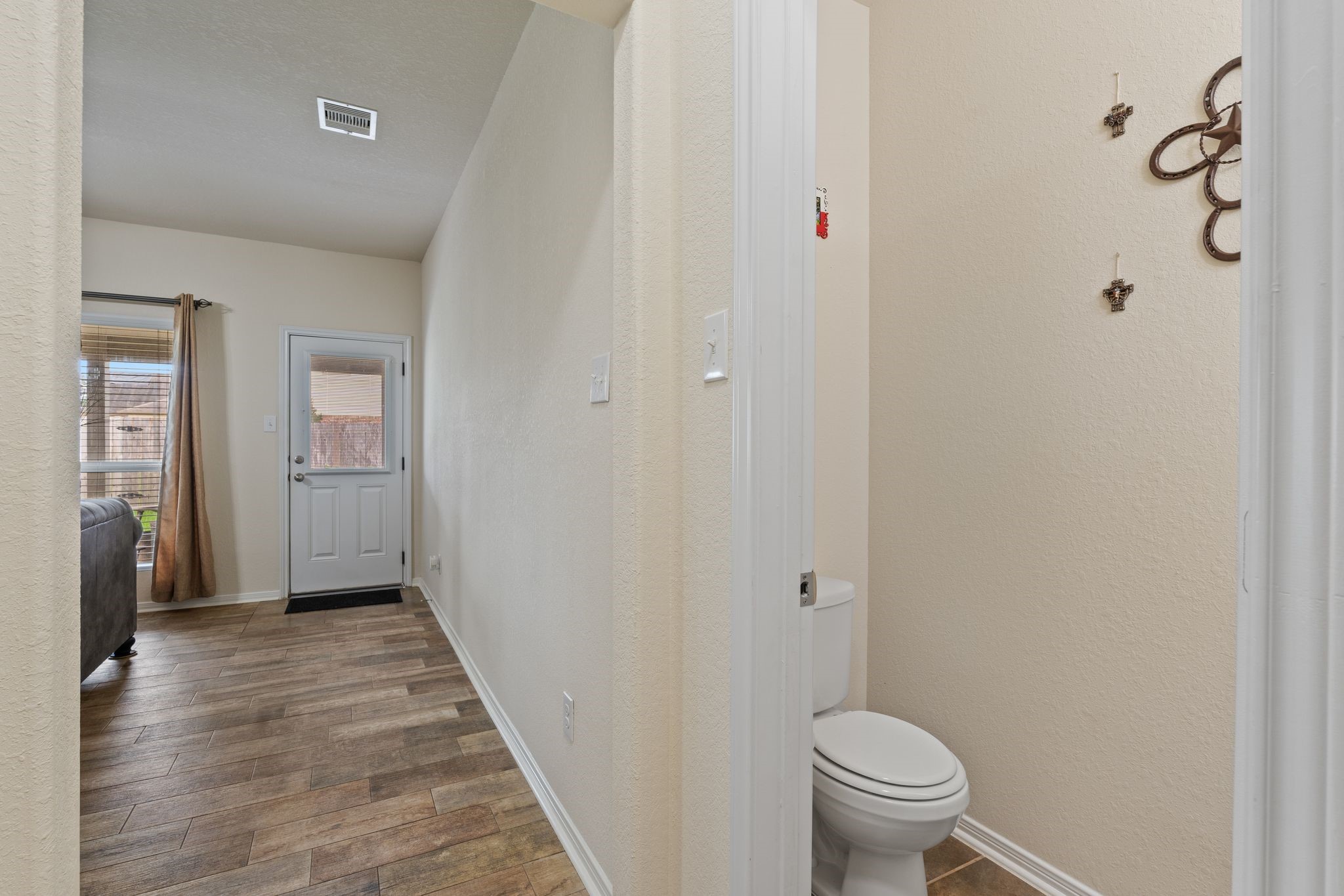 2678 Elm Crossing Trail Spring, TX 77386 - Photo 18 of 42 On your way to the primary is a half bathroom for guests.