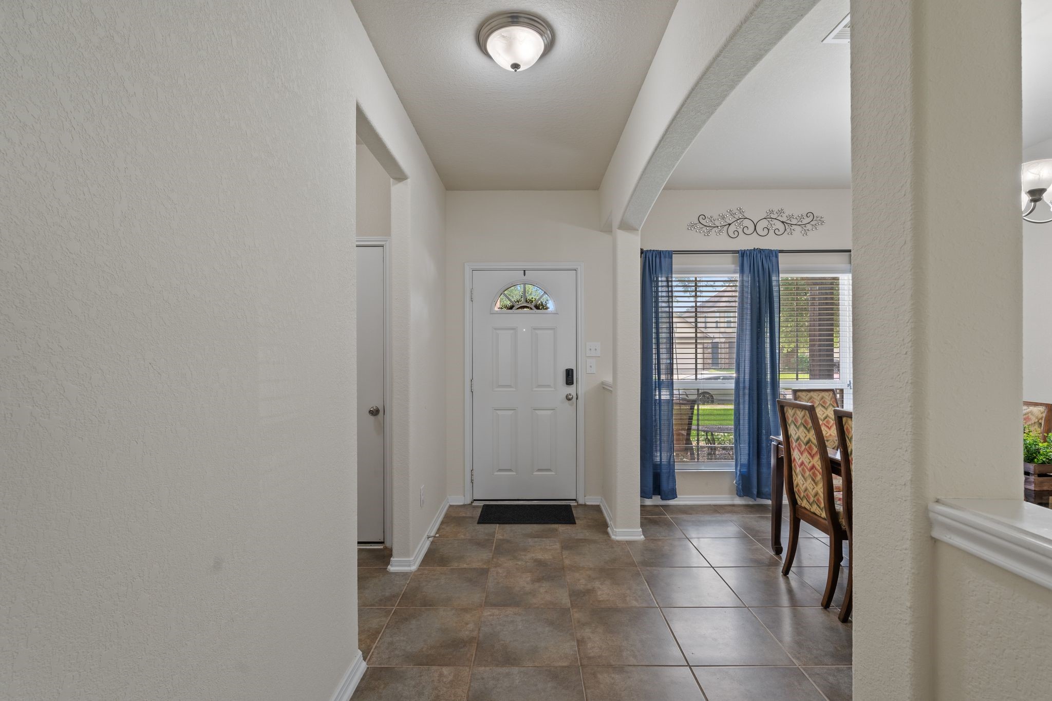 2678 Elm Crossing Trail Spring, TX 77386 - Photo 8 of 42 To your left is a storage closet and the door leading to the garage.