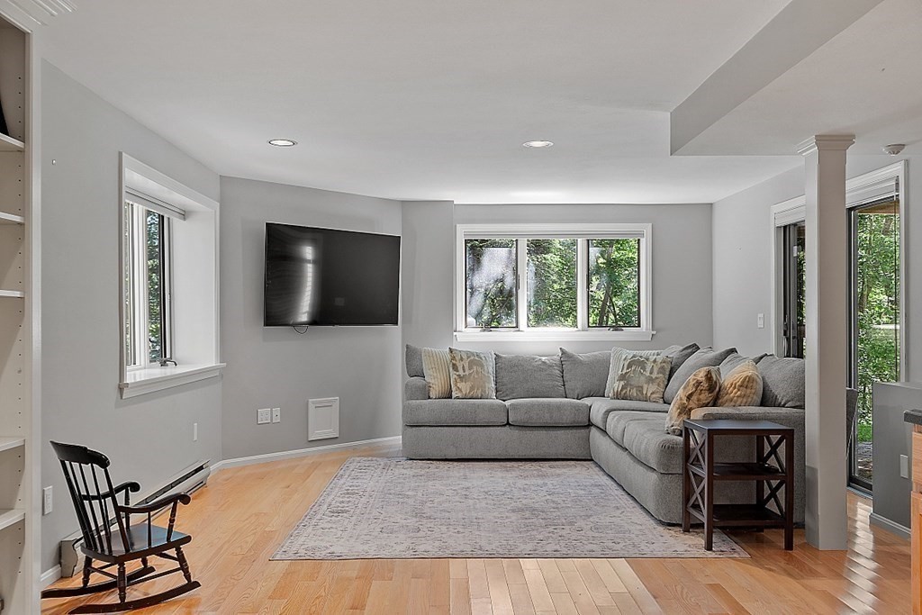 41 Quarry Ridge Lane, Unit 41 Rockport, MA 01966 - Photo 11 of 23 a living room with furniture and a flat screen tv