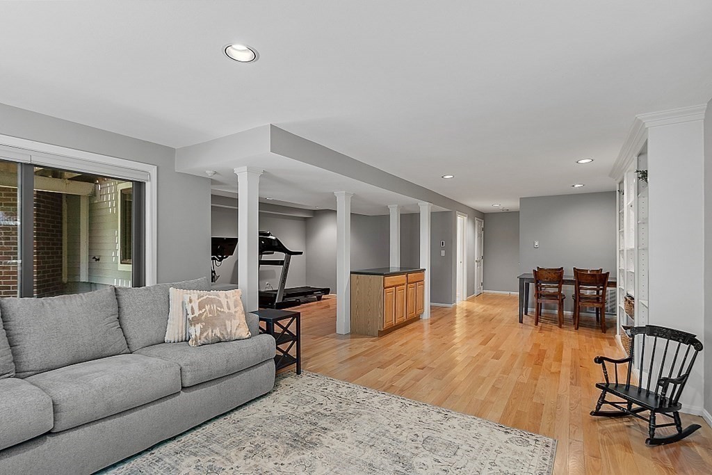 41 Quarry Ridge Lane, Unit 41 Rockport, MA 01966 - Photo 13 of 23 a living room with furniture and a table