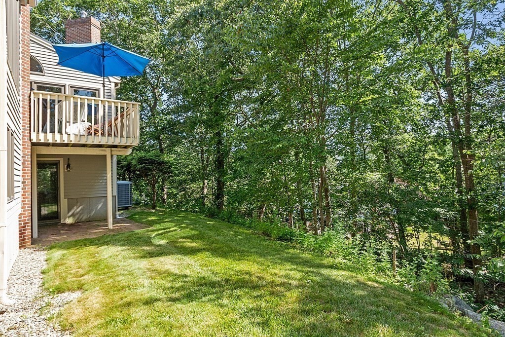 41 Quarry Ridge Lane, Unit 41 Rockport, MA 01966 - Photo 16 of 23 a view of a house with a yard