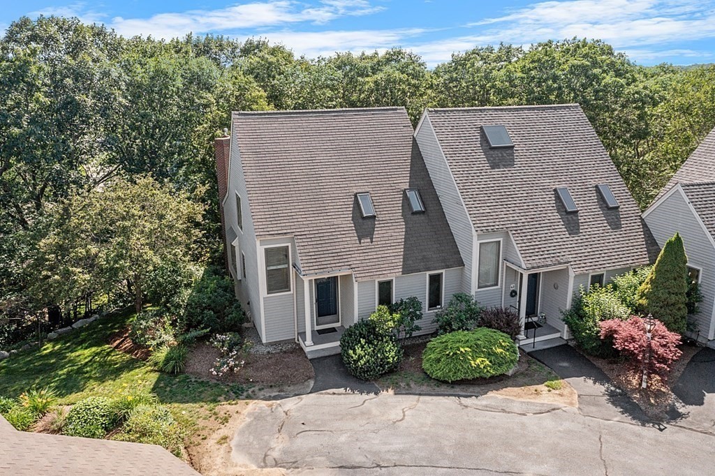 41 Quarry Ridge Lane, Unit 41 Rockport, MA 01966 - Photo 20 of 23 a aerial view of a house with a yard and potted plants