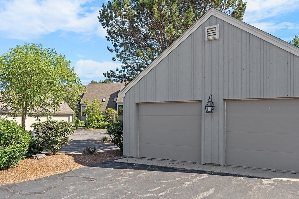 41 Quarry Ridge Lane, Unit 41 Rockport, MA 01966 - Photo 21 of 23 a backyard of a house