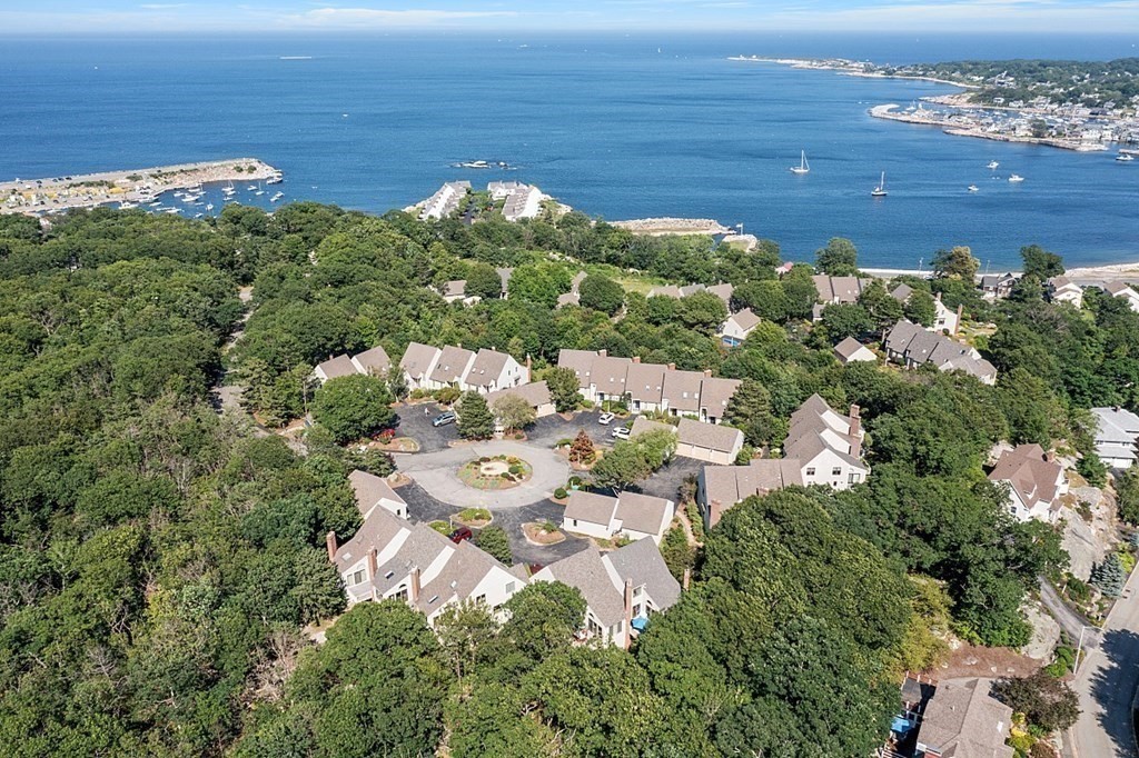 41 Quarry Ridge Lane, Unit 41 Rockport, MA 01966 - Photo 23 of 23 a aerial view of a house with a yard
