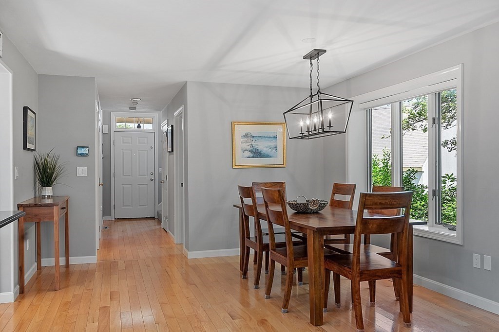 41 Quarry Ridge Lane, Unit 41 Rockport, MA 01966 - Photo 4 of 23 a dining room with furniture window entryway and wooden floor