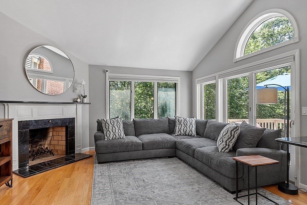 41 Quarry Ridge Lane, Unit 41 Rockport, MA 01966 - Photo 7 of 23 a living room with furniture and a fireplace