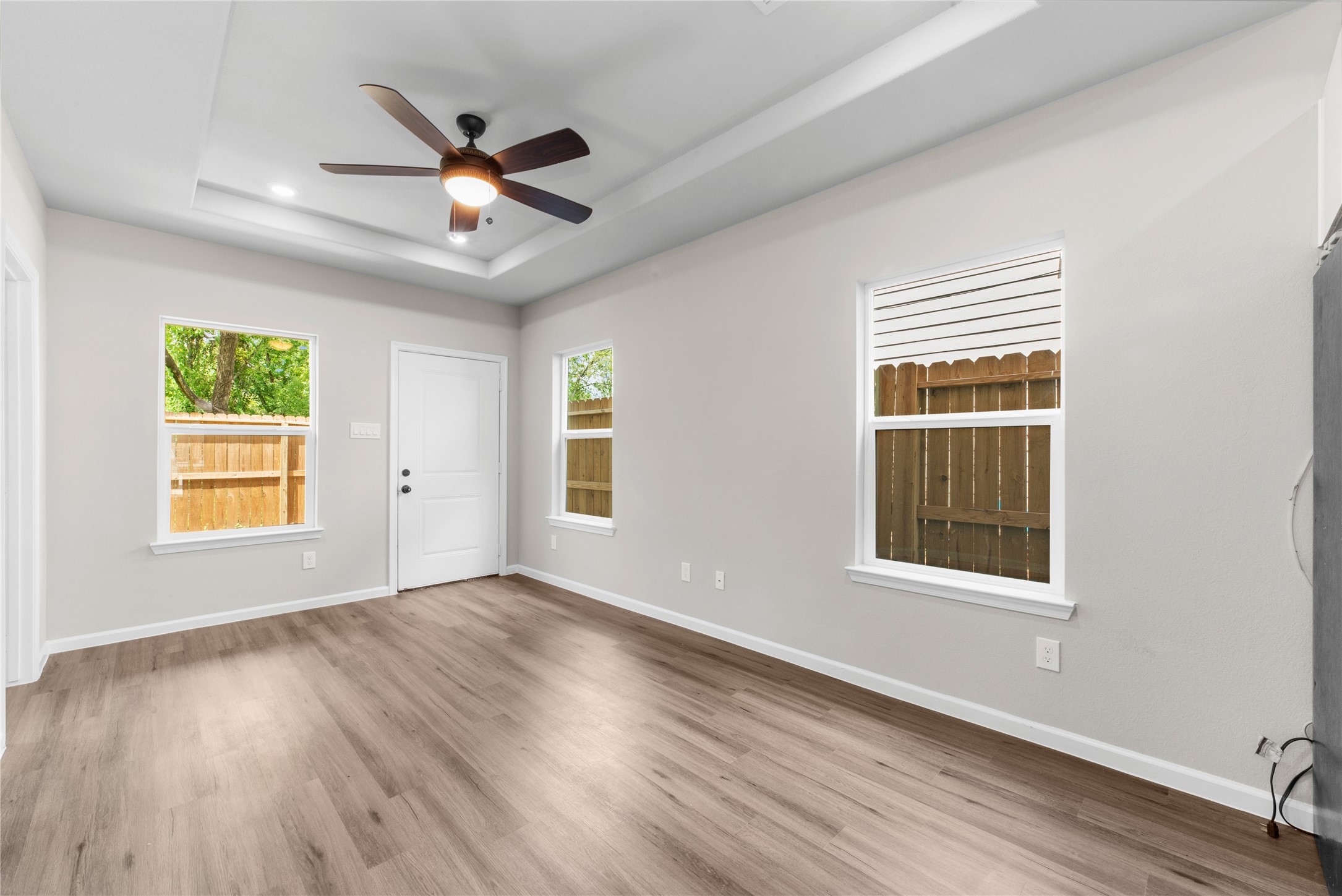 8161 Tate Street, Unit B Houston, TX 77028 - Photo 5 of 14 a view of an empty room with wooden floor and a window
