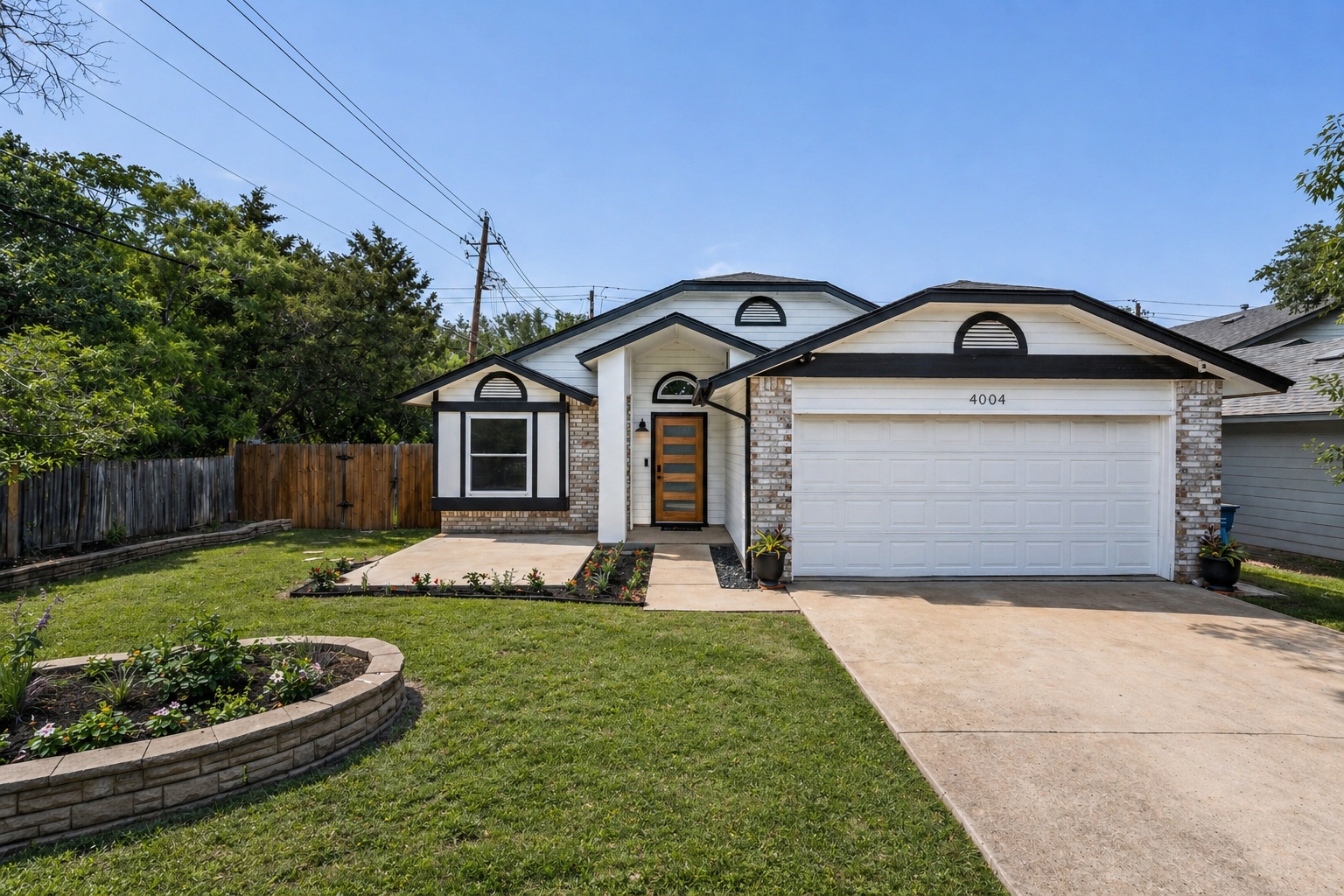 4004 Danli Lane Austin, TX 78749 - Photo 2 of 40 a front view of a house with a yard and garage