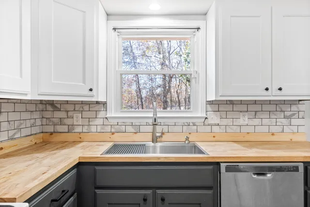 a kitchen with a sink and a window