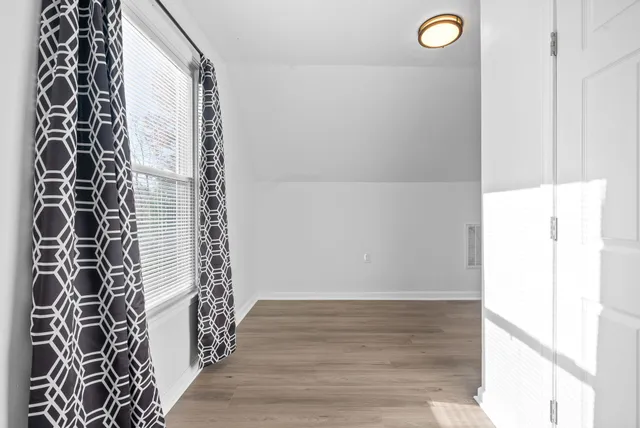 a view of a bathroom with sink and shower