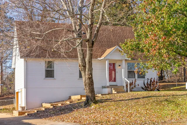 a view of a house with snow on the road