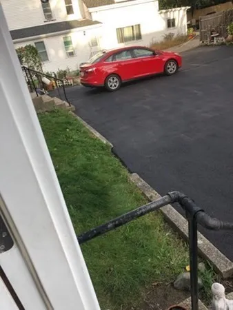 a view of a street with cars on road