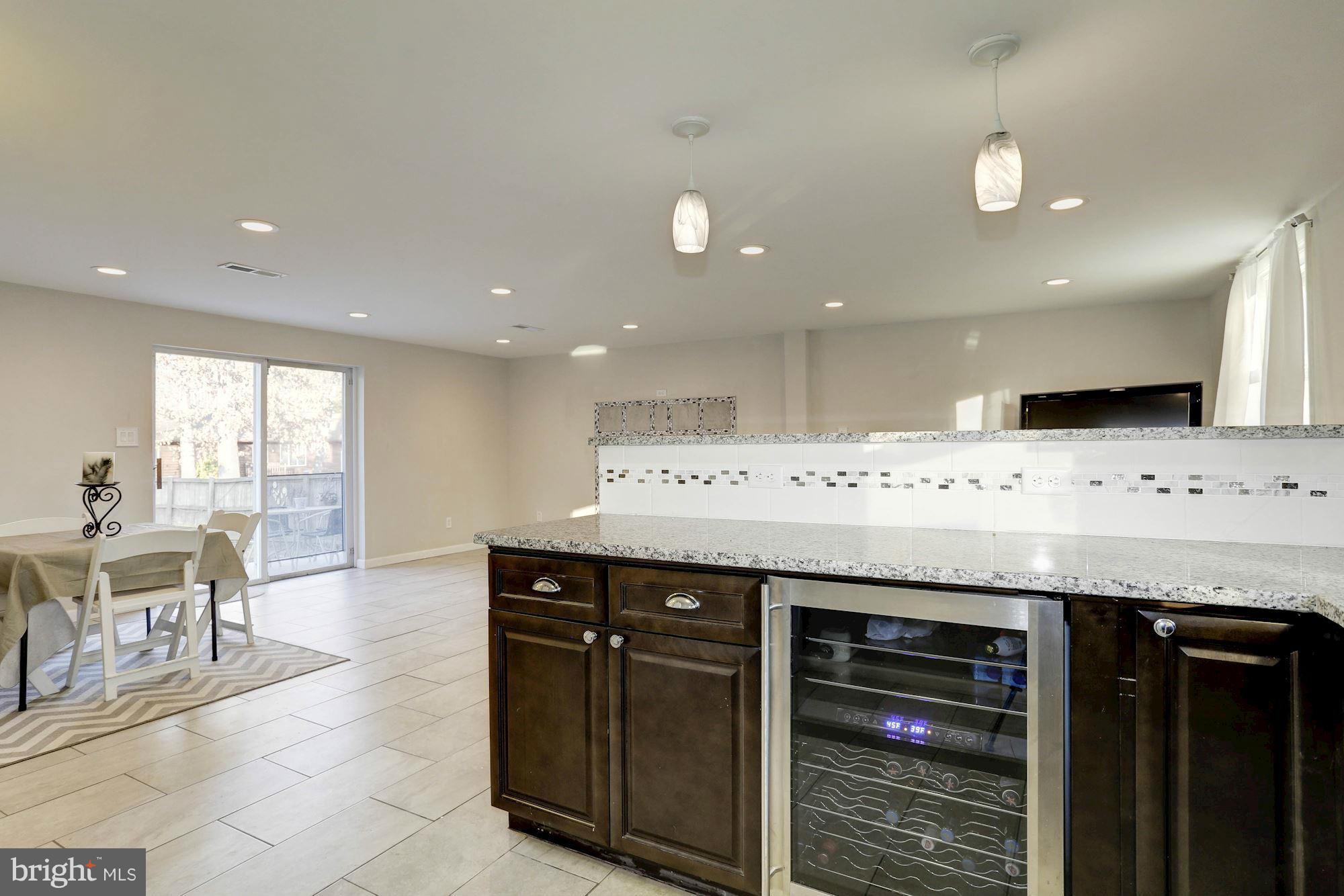 4634 Mountain Road Pasadena, MD 21122 - Photo 23 of 30 Lower level kitchen with granite and new cabinetry