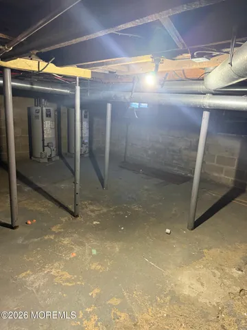 a view of roof deck with wooden floor and seating space