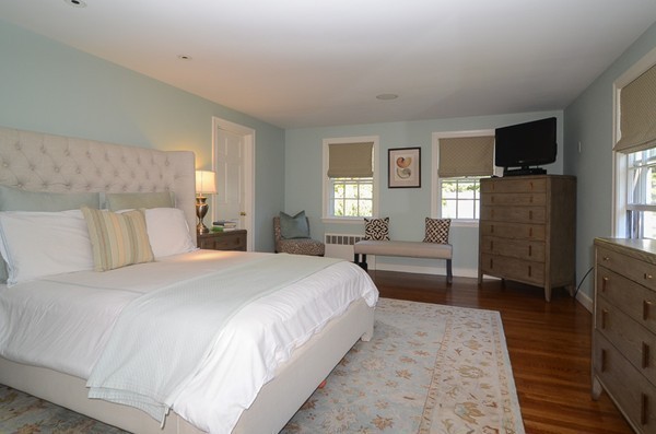 154 Hampshire Road Wellesley, MA 02481 - Photo 13 of 30 a bedroom with a bed and a flat screen tv