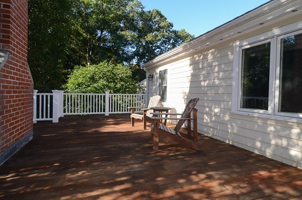 154 Hampshire Road Wellesley, MA 02481 - Photo 16 of 30 a view of a patio with a table and chairs
