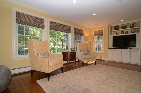 154 Hampshire Road Wellesley, MA 02481 - Photo 9 of 30 a living room with furniture and a flat screen tv