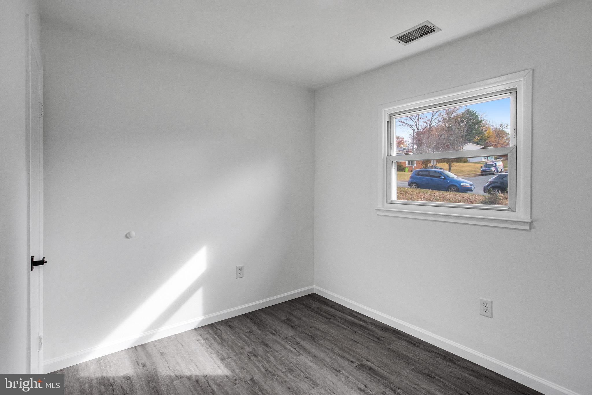 3412 North Beaumont Road Woodbridge, VA 22193 - Photo 15 of 34 an empty room with wooden floor and window