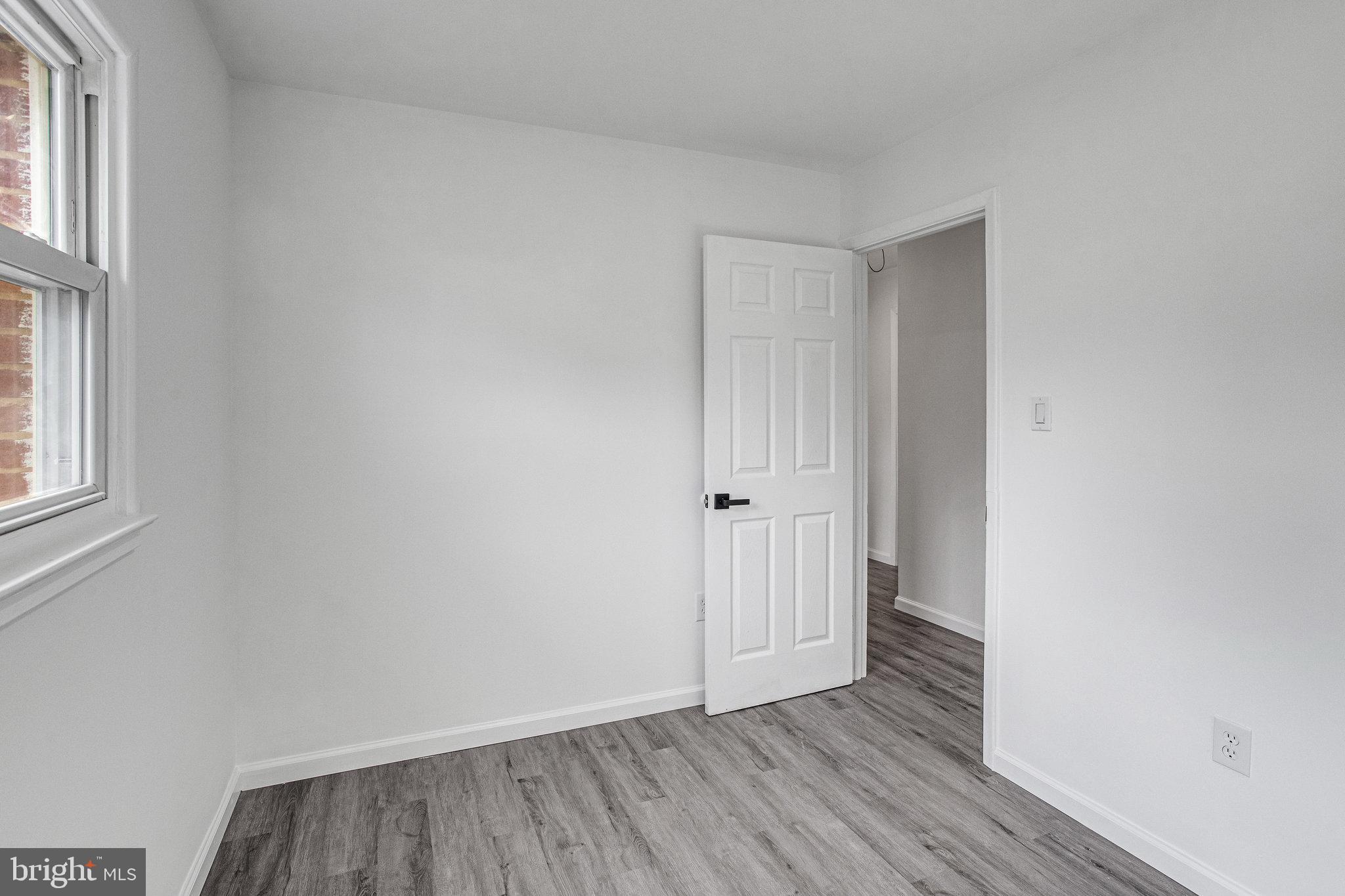 3412 North Beaumont Road Woodbridge, VA 22193 - Photo 16 of 34 a view of an empty room with wooden floor and window