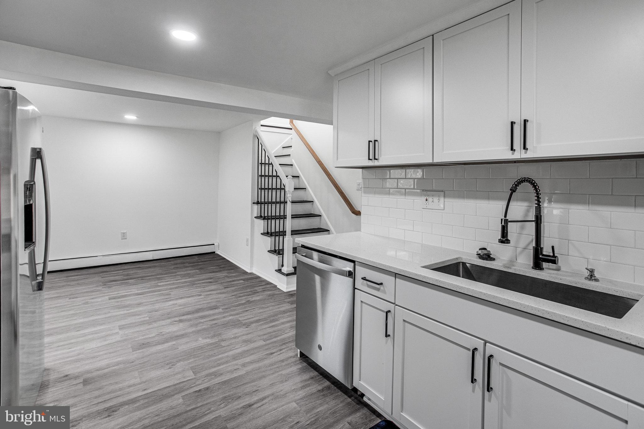 3412 North Beaumont Road Woodbridge, VA 22193 - Photo 22 of 34 a kitchen with a sink and wooden floor