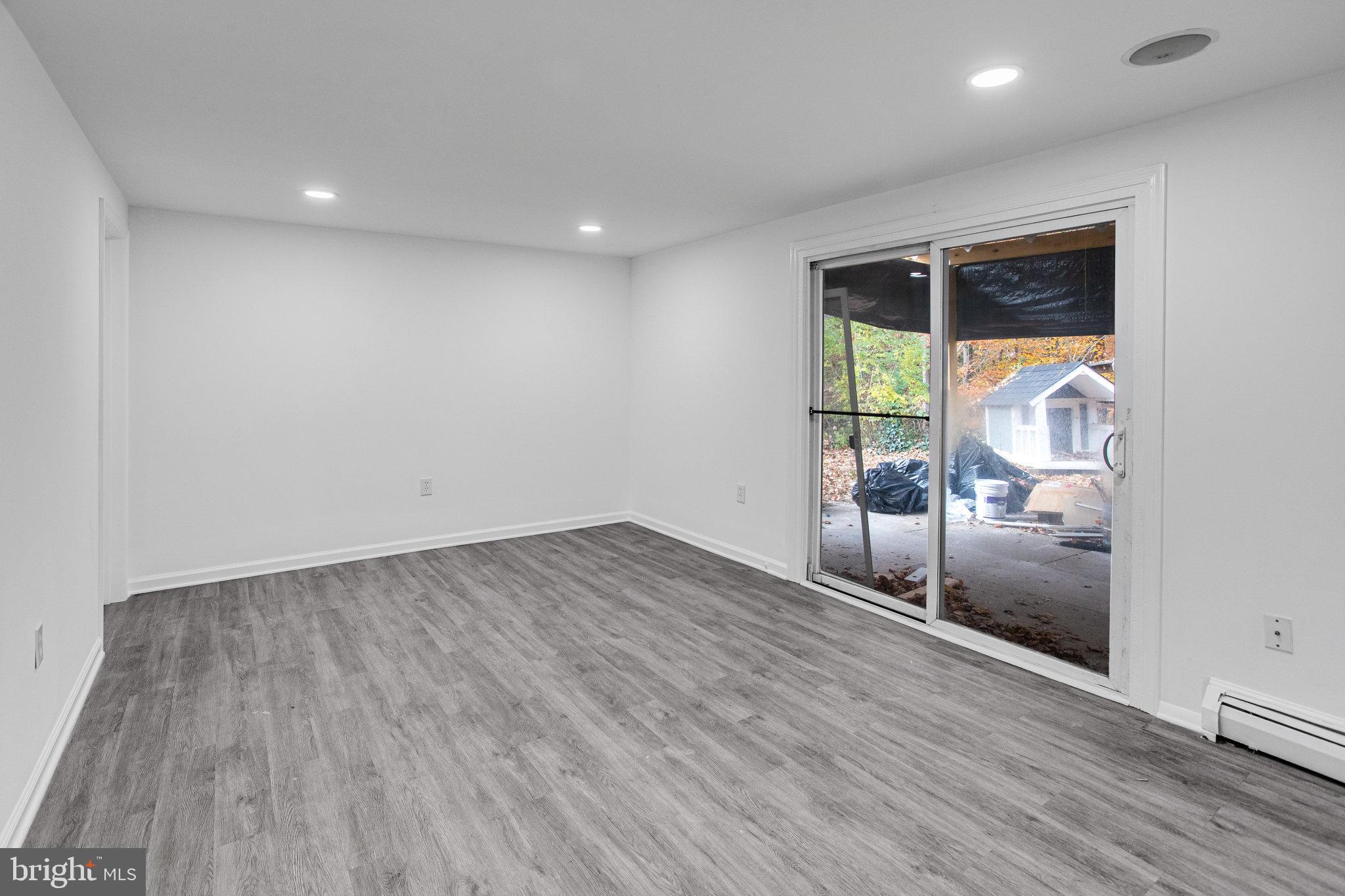 3412 North Beaumont Road Woodbridge, VA 22193 - Photo 25 of 34 an empty room with wooden floor and windows