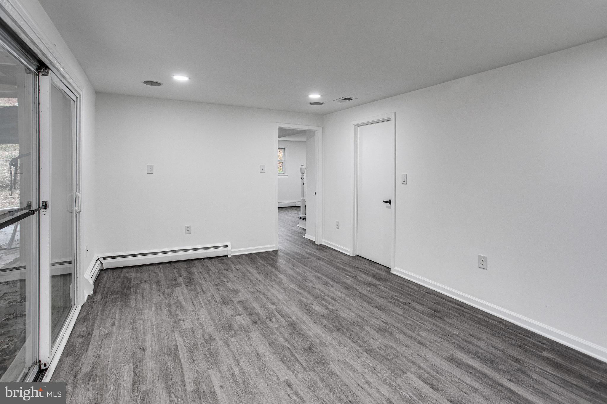 3412 North Beaumont Road Woodbridge, VA 22193 - Photo 26 of 34 a view of an empty room with wooden floor and a window