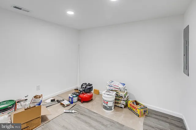 a view of a room with wooden floor