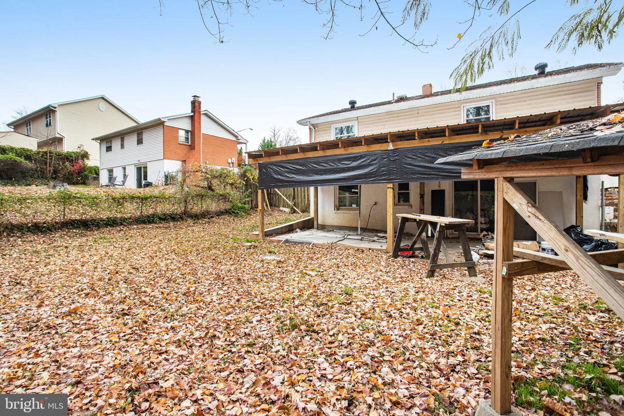3412 North Beaumont Road Woodbridge, VA 22193 - Photo 33 of 34 a view of a house with a wooden deck and a chair