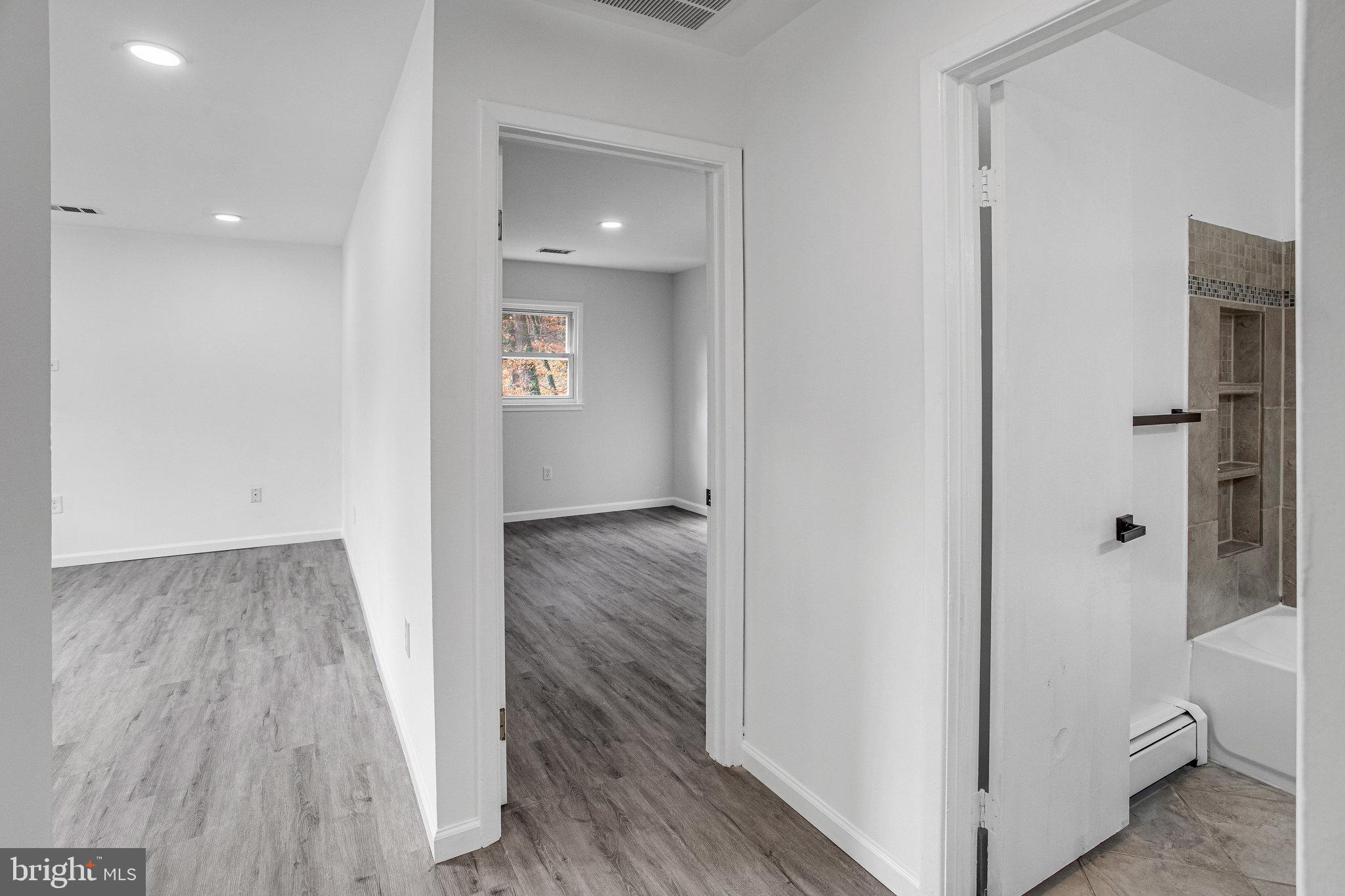 3412 North Beaumont Road Woodbridge, VA 22193 - Photo 7 of 34 a view of a hallway with wooden floor and closet