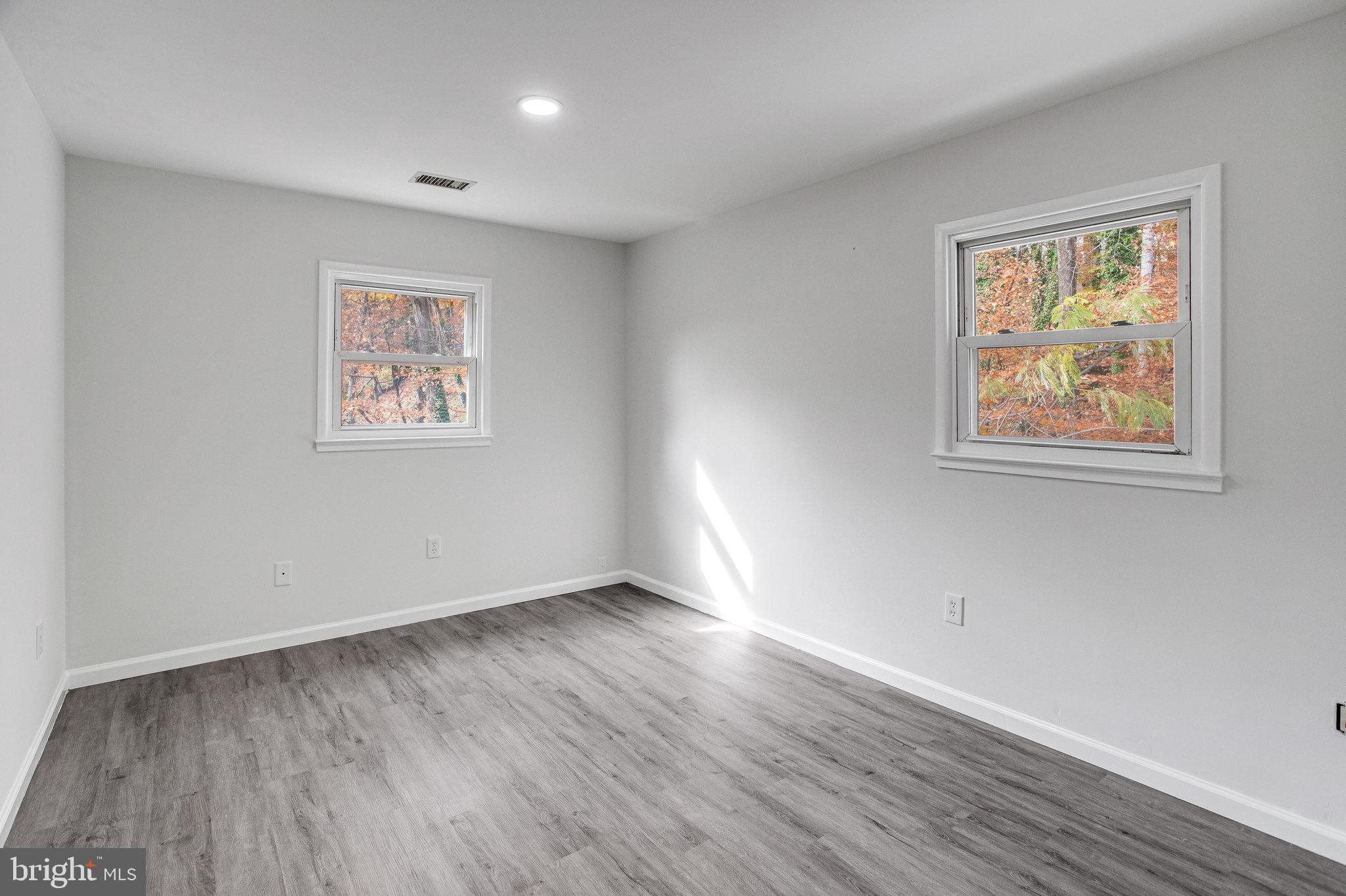3412 North Beaumont Road Woodbridge, VA 22193 - Photo 8 of 34 a view of an empty room with wooden floor and a window