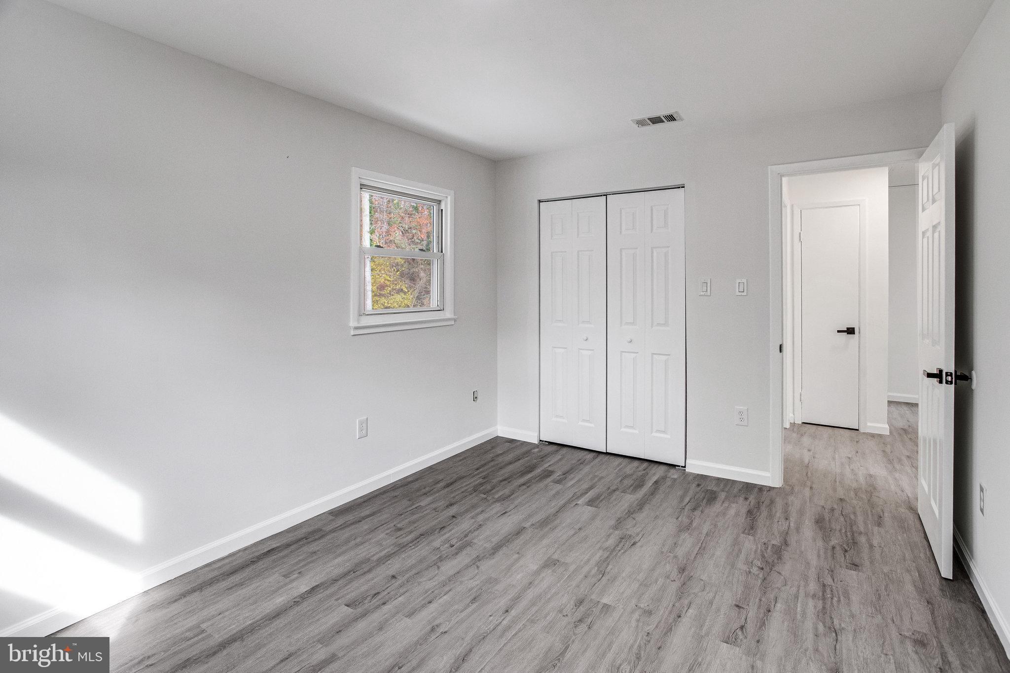 3412 North Beaumont Road Woodbridge, VA 22193 - Photo 9 of 34 a view of an empty room with wooden floor