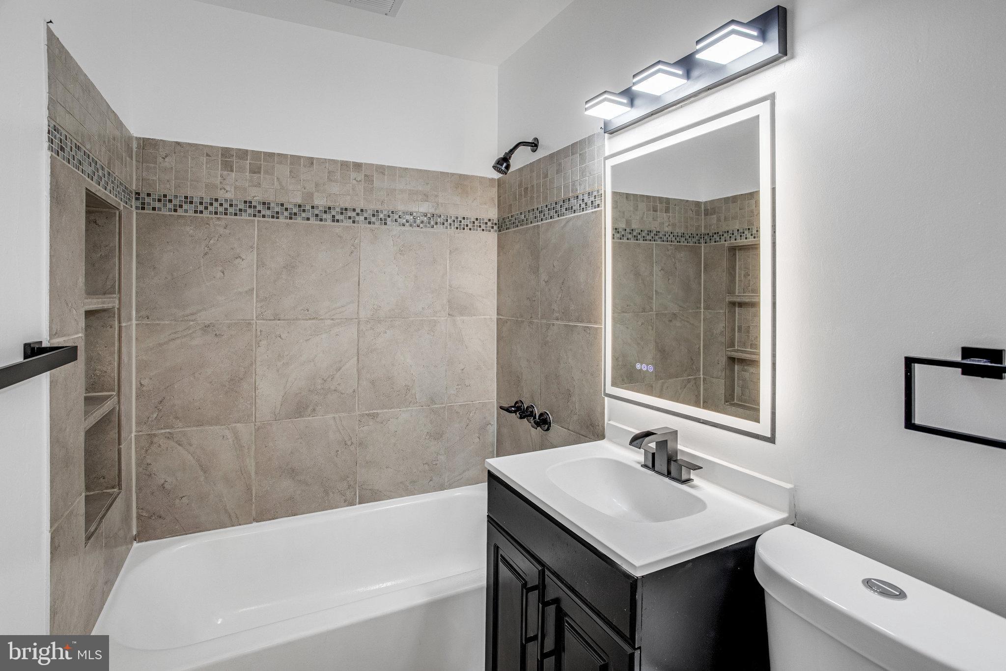 3412 North Beaumont Road Woodbridge, VA 22193 - Photo 10 of 34 a bathroom with a sink toilet tub and shower