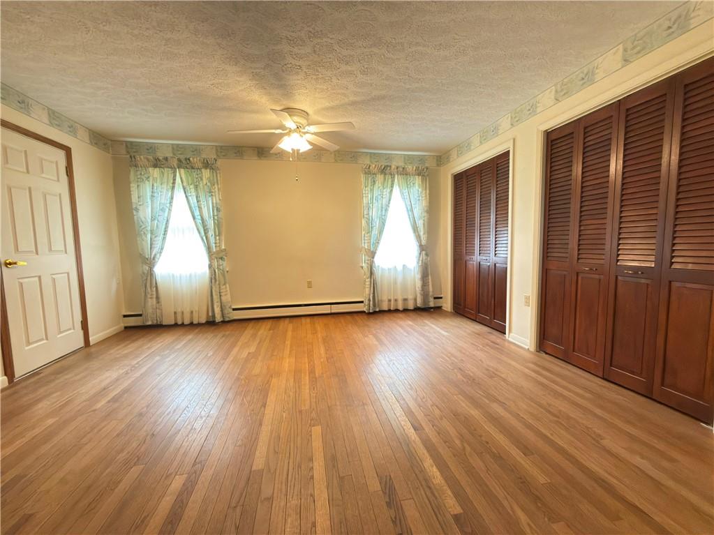 123 Hadley Road Greenville, PA 16125 - Photo 33 of 49 an empty room with wooden floor and windows