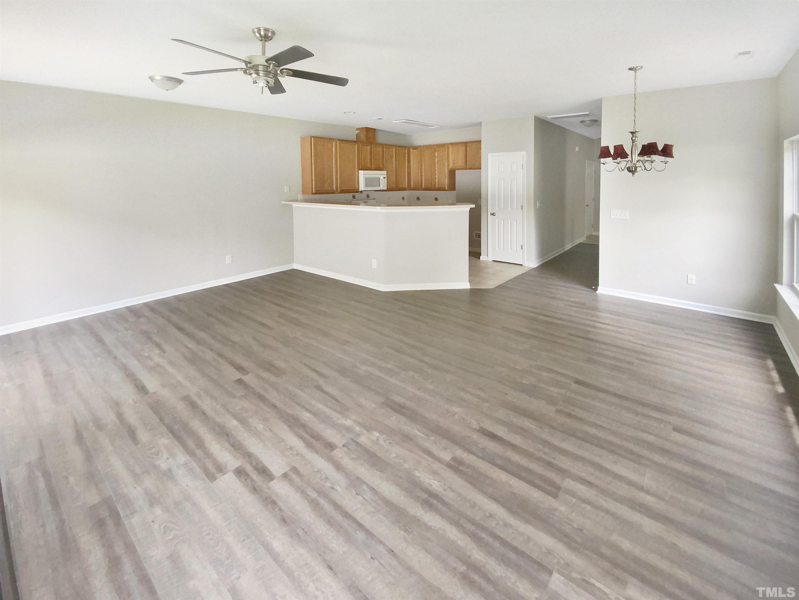 5105 Sandy Banks Road Raleigh, NC 27616 - Photo 12 of 15 a view of a room with wooden floor and closet