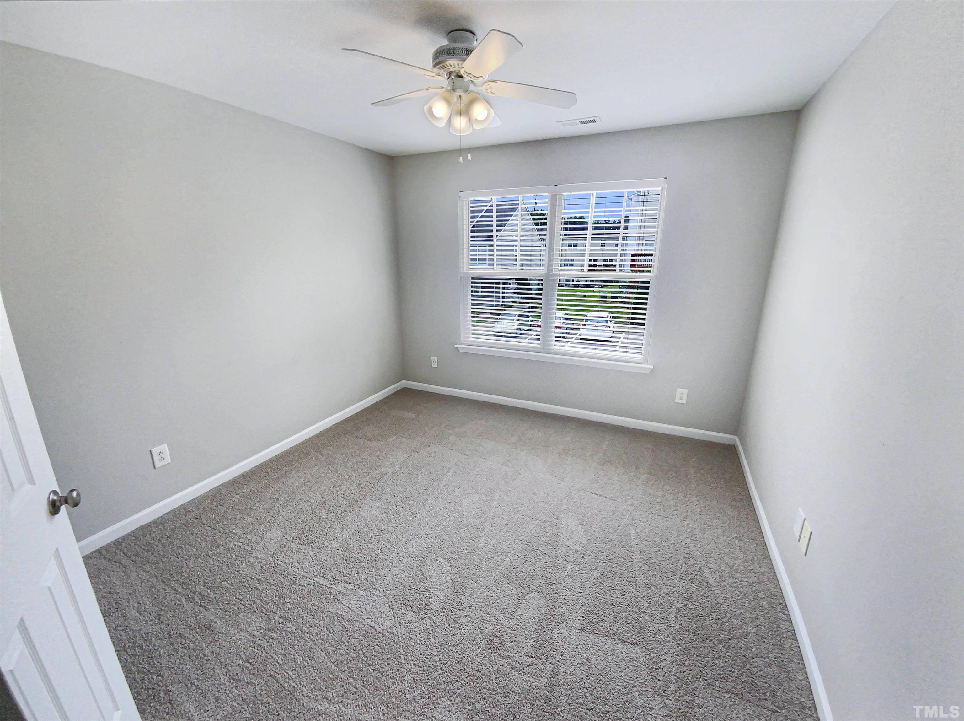 5105 Sandy Banks Road Raleigh, NC 27616 - Photo 7 of 15 an empty room with a window