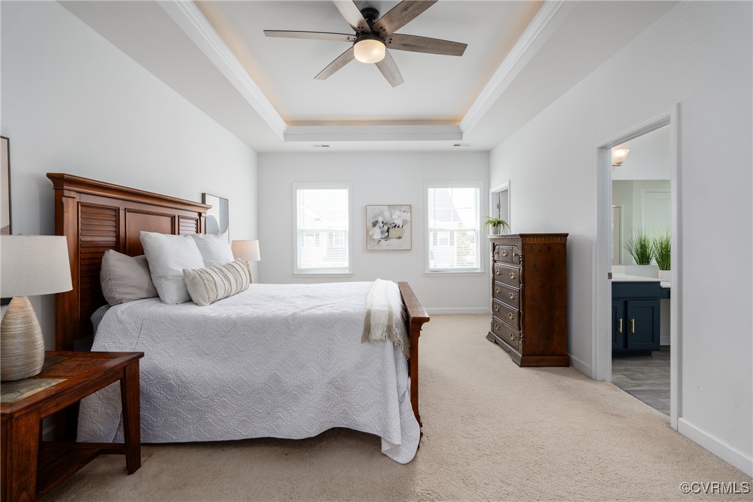 4816 Breeching Dee Lane Henrico, VA 23294 - Photo 14 of 25 a bed room with a bed and a chandelier