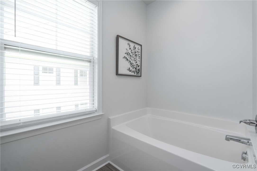 4816 Breeching Dee Lane Henrico, VA 23294 - Photo 16 of 25 a white bath tub sitting next to a window