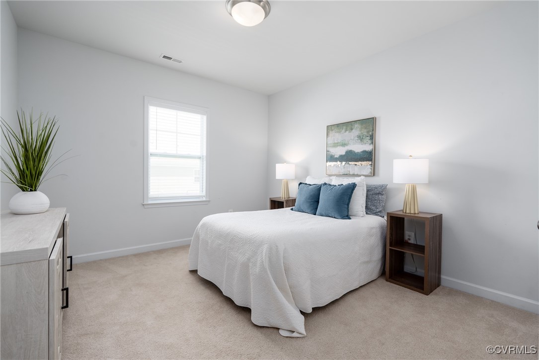 4816 Breeching Dee Lane Henrico, VA 23294 - Photo 20 of 25 a bedroom with a bed and a window