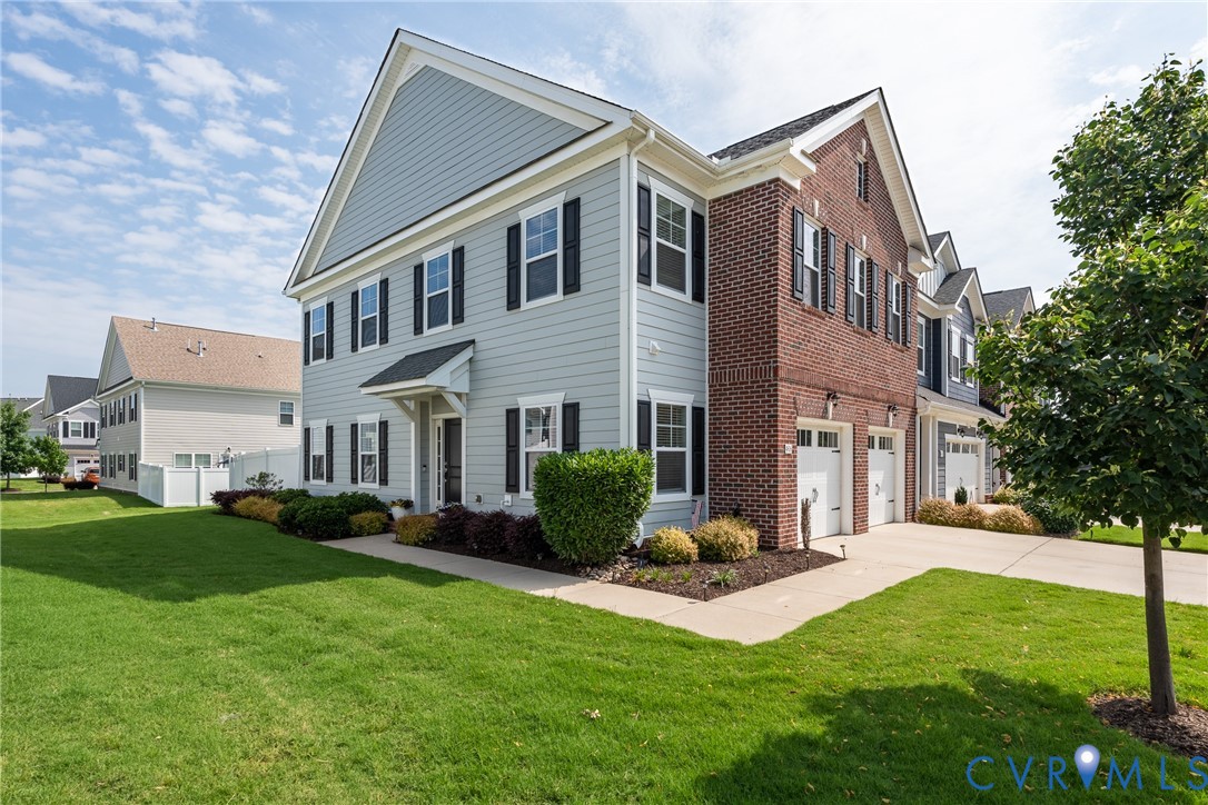 4816 Breeching Dee Lane Henrico, VA 23294 - Photo 2 of 25 a front view of a house with a yard and green space