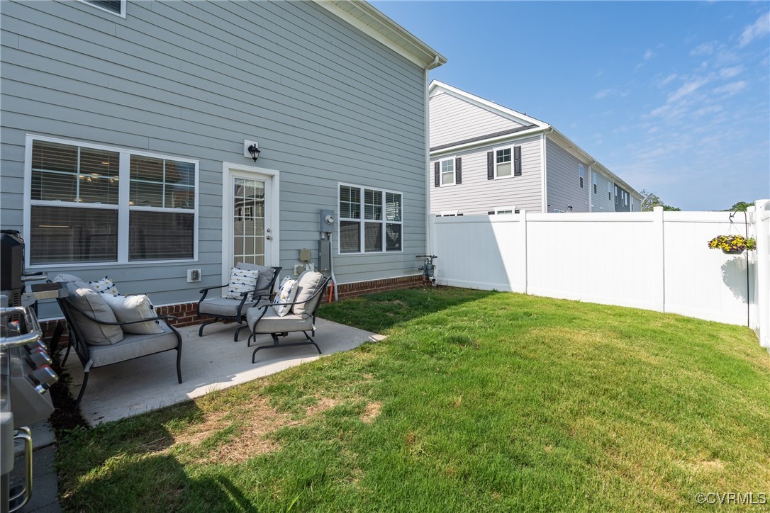 4816 Breeching Dee Lane Henrico, VA 23294 - Photo 23 of 25 a view of a house with patio in the backyard