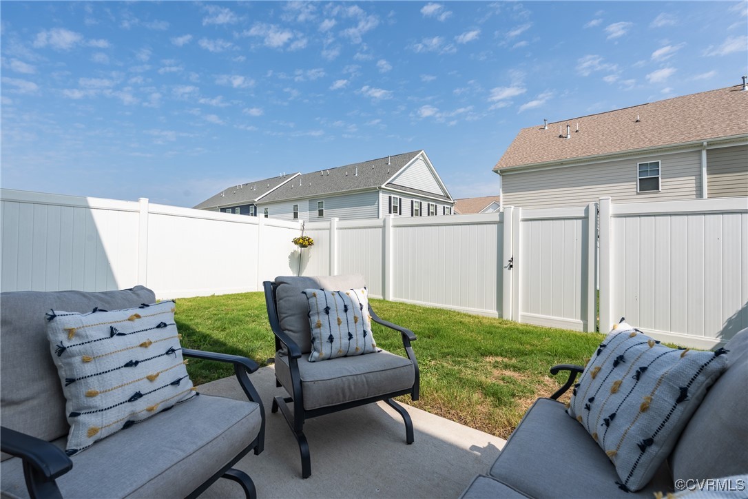 4816 Breeching Dee Lane Henrico, VA 23294 - Photo 24 of 25 a backyard of a house with table and chairs