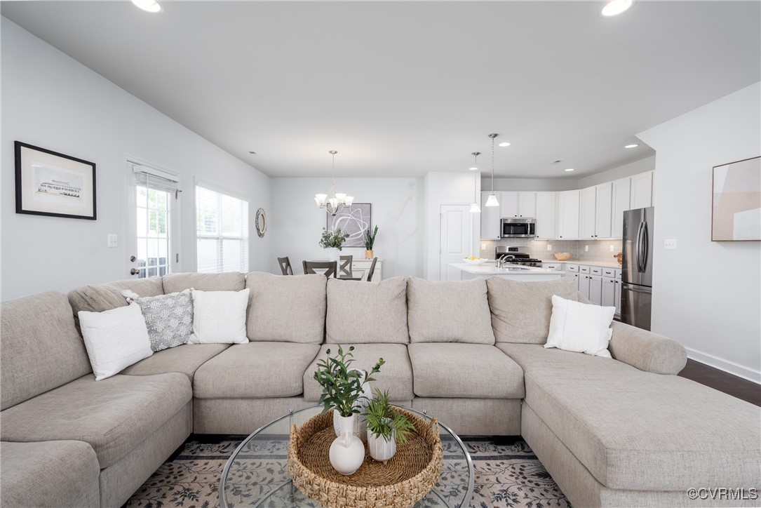 4816 Breeching Dee Lane Henrico, VA 23294 - Photo 7 of 25 a living room with furniture and kitchen view